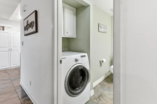 a kitchen with a sink cabinets and utility