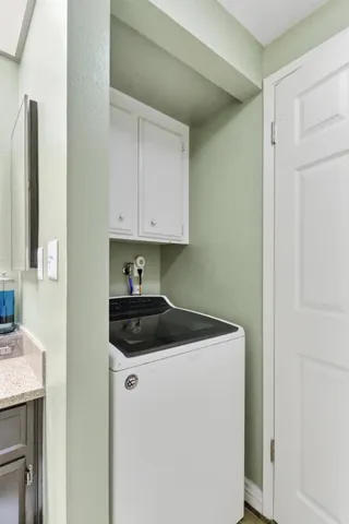 a bathroom with a shower and a sink
