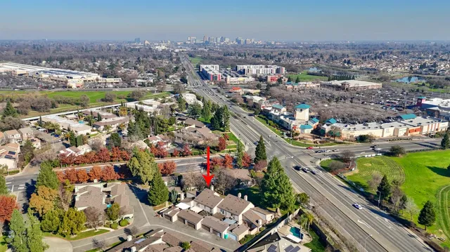 an aerial view of residential house with outdoor space and swimming pool