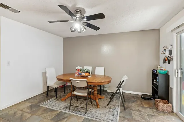 a kitchen with stainless steel appliances granite countertop a sink and refrigerator