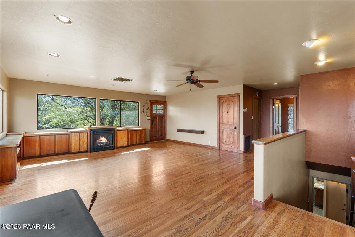 646 South Rancho Vista Drive Prescott, AZ 86303 - Photo 11 of 50 a view of an empty room with wooden floor and a window