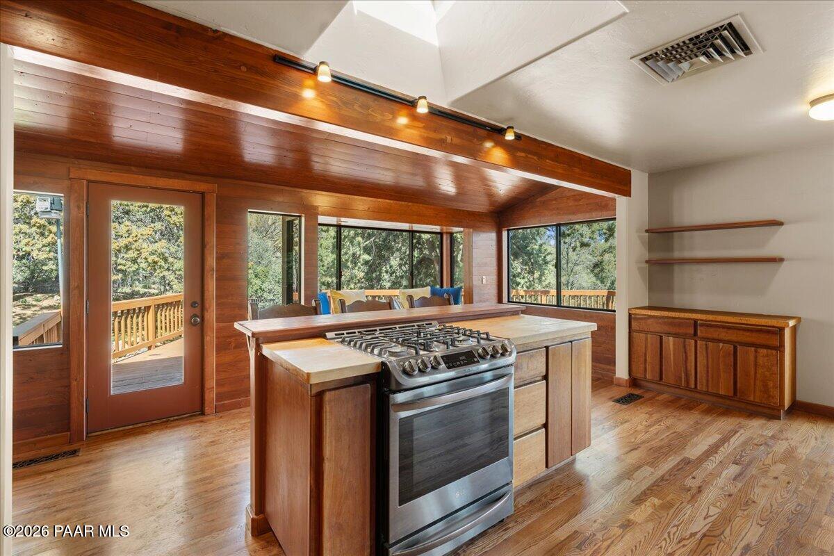 646 South Rancho Vista Drive Prescott, AZ 86303 - Photo 15 of 50 a kitchen with a stove and a wooden floor
