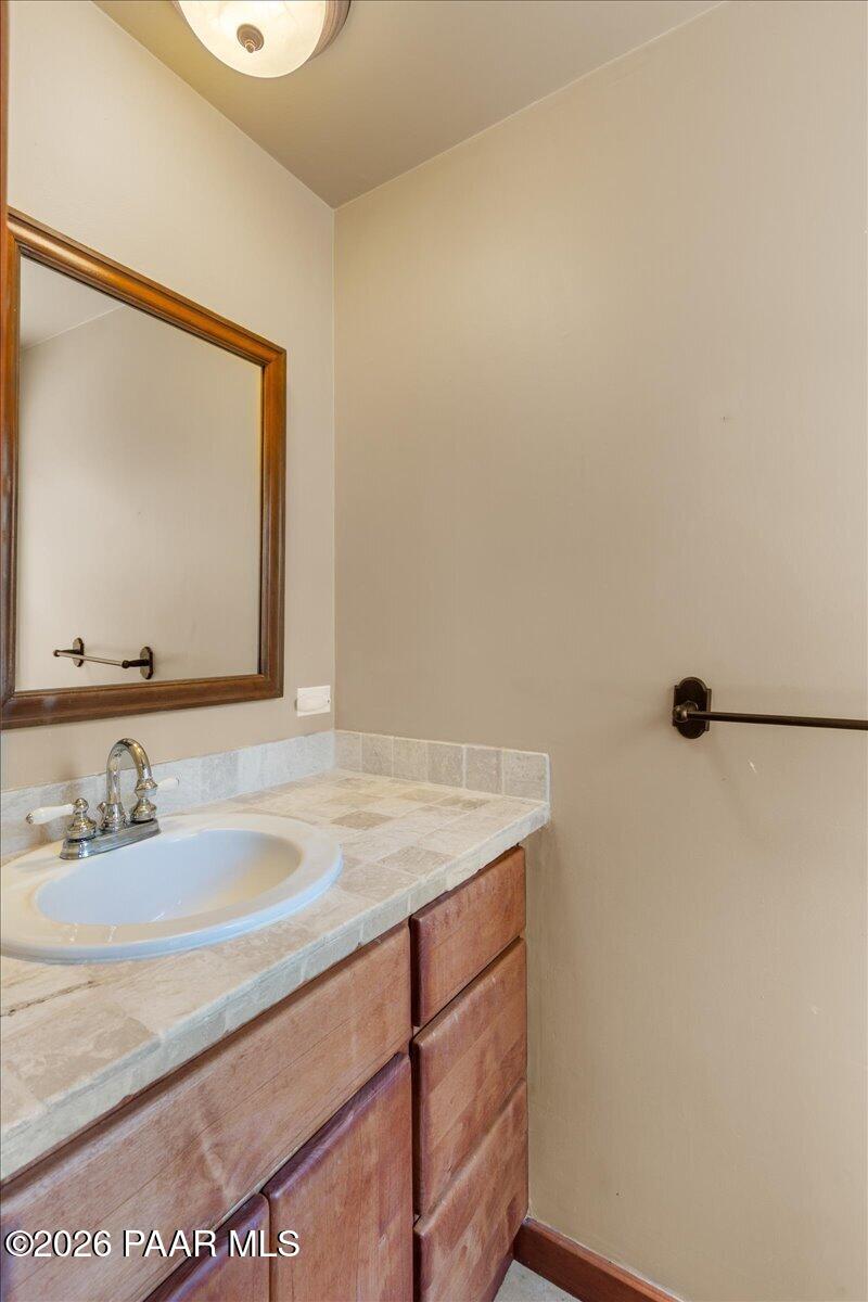 646 South Rancho Vista Drive Prescott, AZ 86303 - Photo 20 of 50 a bathroom with a sink and a mirror