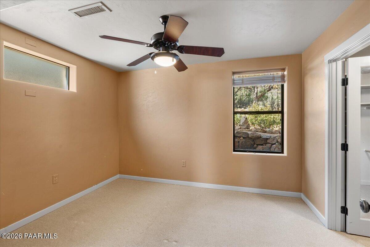 646 South Rancho Vista Drive Prescott, AZ 86303 - Photo 27 of 50 an empty room with windows and fan