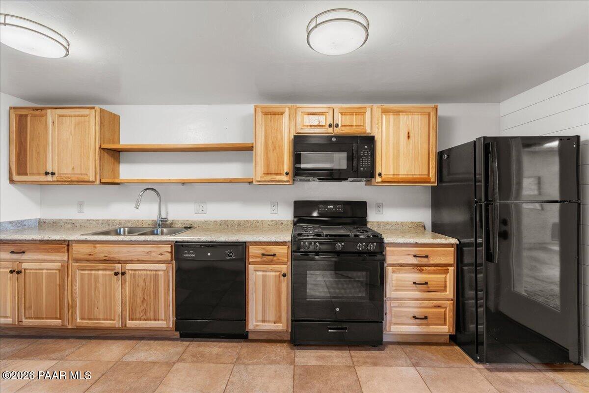 646 South Rancho Vista Drive Prescott, AZ 86303 - Photo 33 of 50 a kitchen with a sink stove and refrigerator