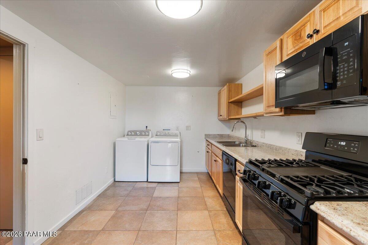 646 South Rancho Vista Drive Prescott, AZ 86303 - Photo 34 of 50 a kitchen with stainless steel appliances a stove top oven a sink and dishwasher