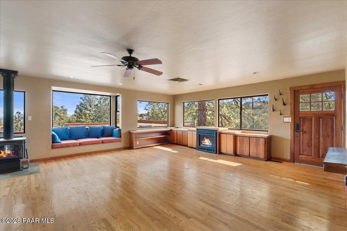 646 South Rancho Vista Drive Prescott, AZ 86303 - Photo 9 of 50 a view of an empty room with a window and wooden floor