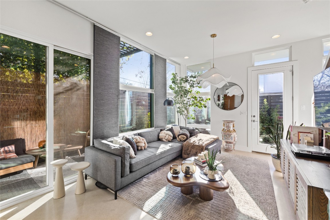 1904 East 17th Street, Unit B Austin, TX 78702 - Photo 16 of 34 a living room with furniture fireplace and a large window
