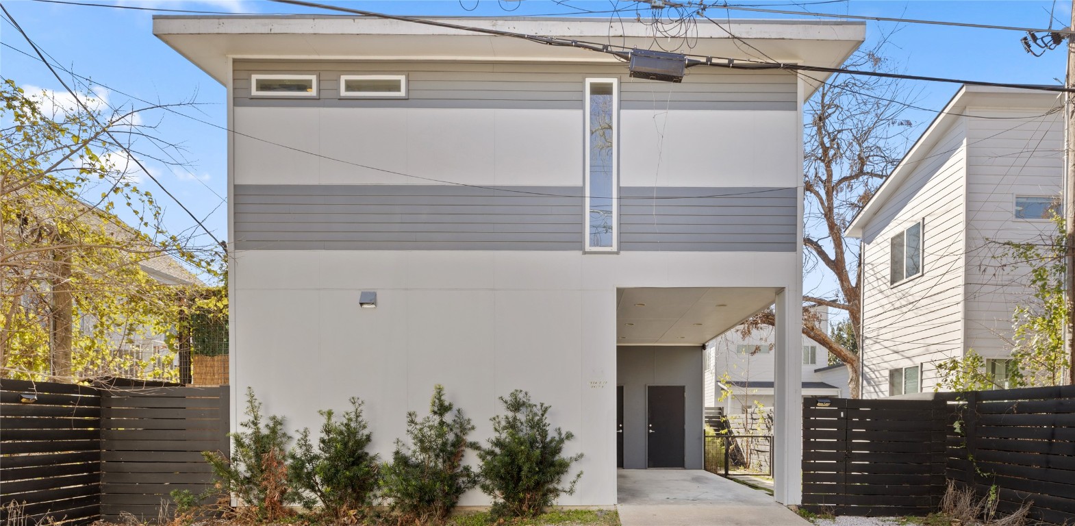 1904 East 17th Street, Unit B Austin, TX 78702 - Photo 33 of 34 a front view of a house with a yard