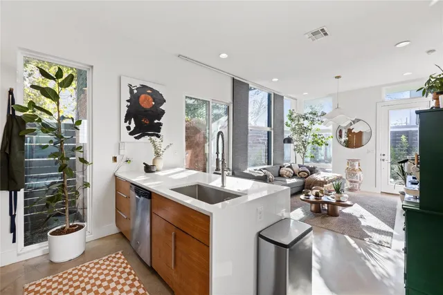 a kitchen with a sink appliances and a counter top space