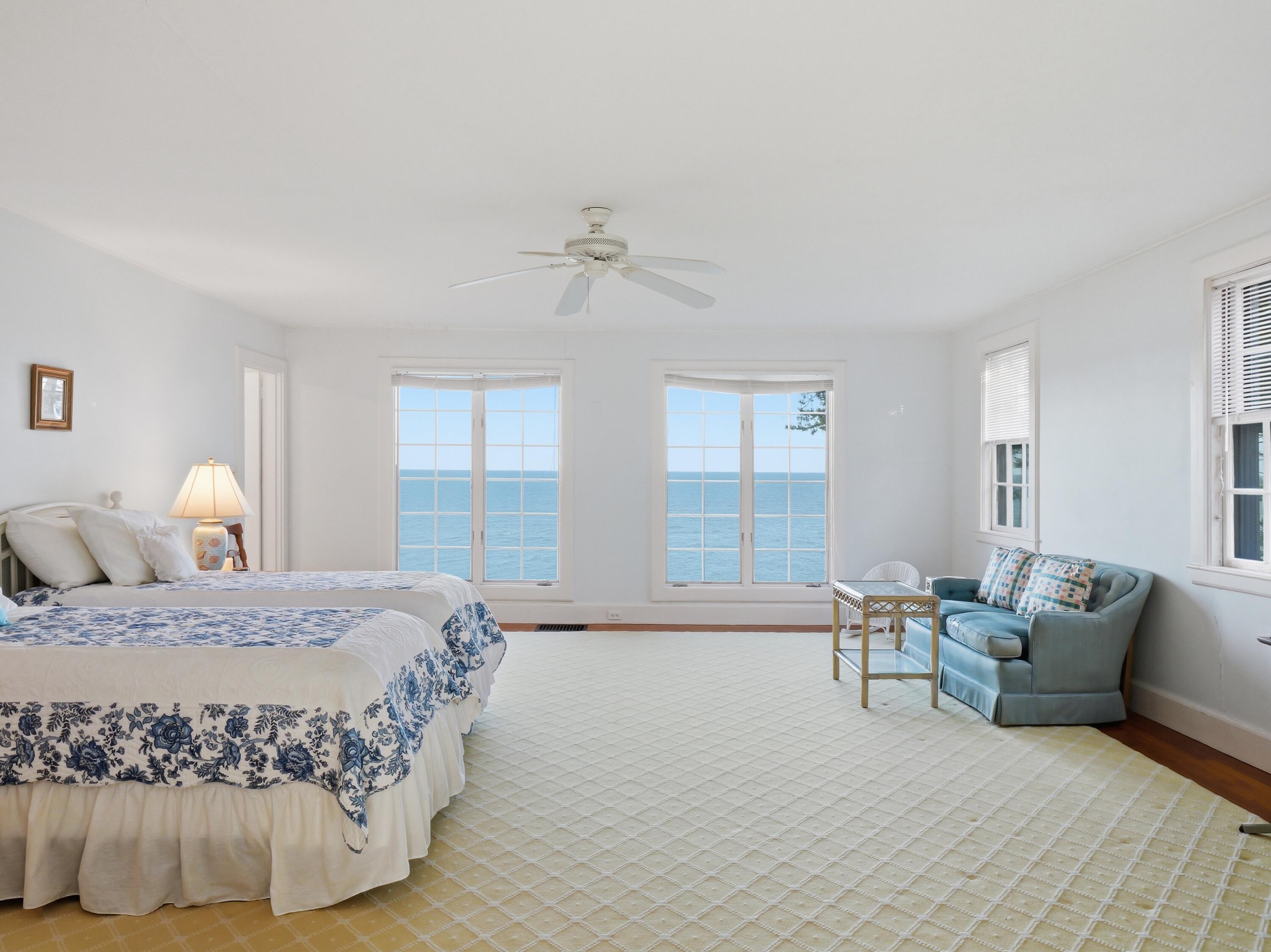 190 Vineyard Road Cotuit, MA 02635 - Photo 25 of 41 a bedroom with a bed and glass door