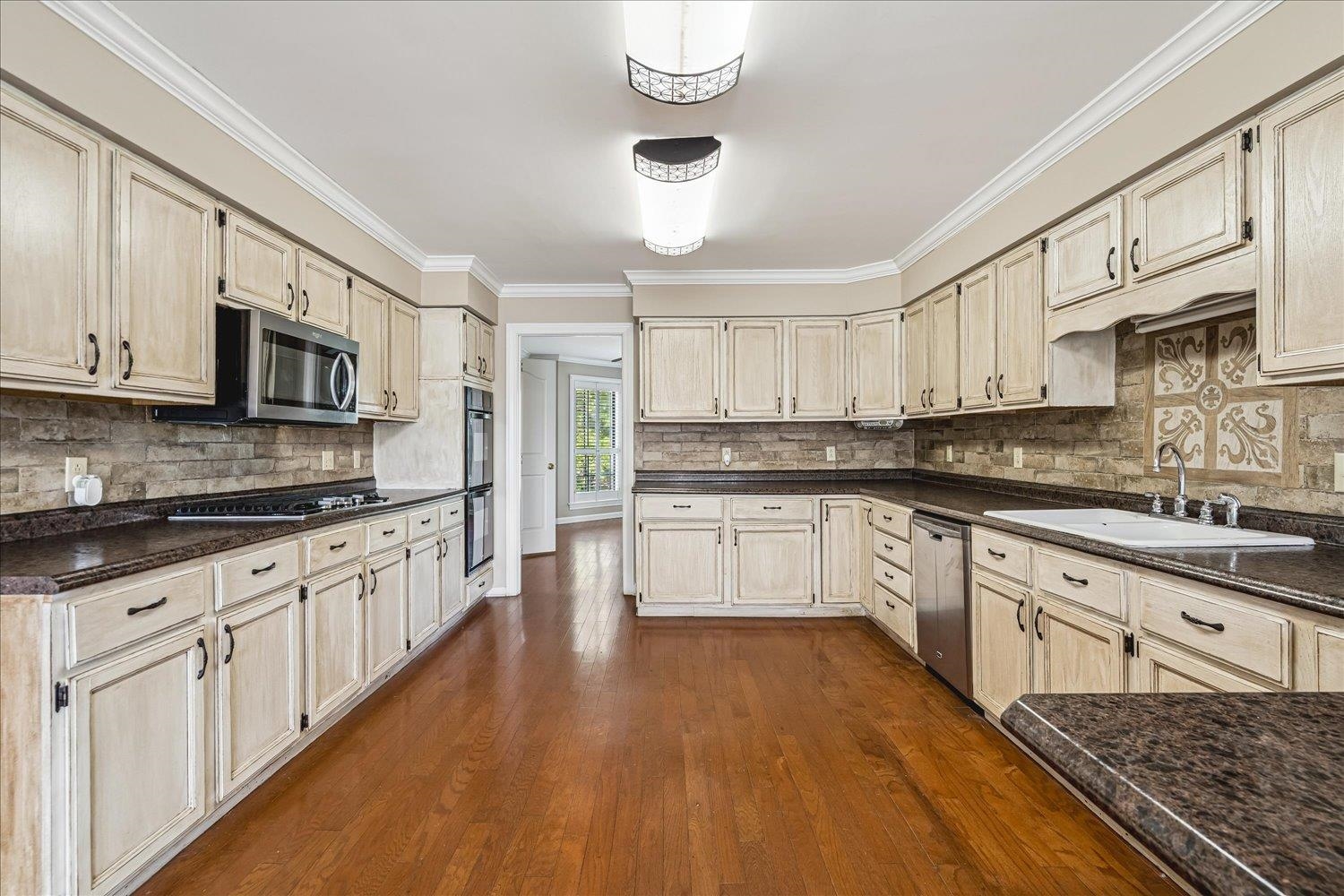 2132 Williams Switch Road Ripley, TN 38063 - Photo 12 of 33 Gas Cooking,Double Ovens,Breakfast Bar.Hardwood Floors.