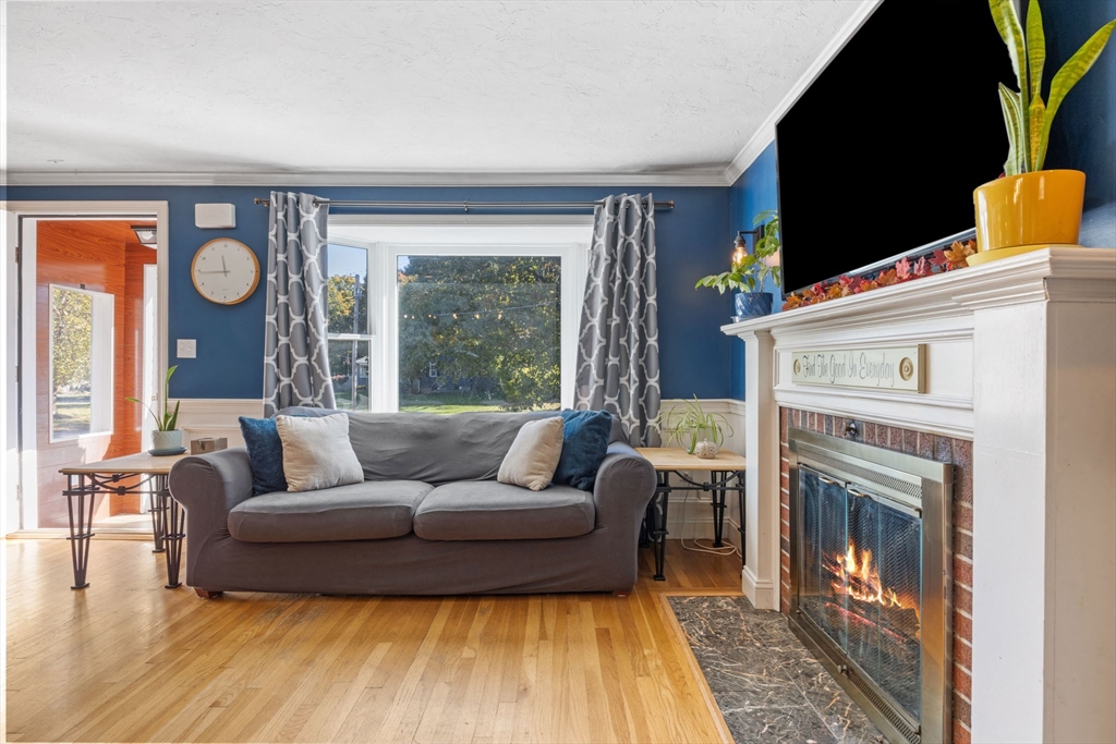 229 Washington Terrace Whitman, MA 02382 - Photo 11 of 30 a living room with furniture and a fireplace