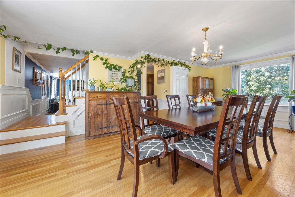 229 Washington Terrace Whitman, MA 02382 - Photo 12 of 30 a view of a dining room with furniture wooden floor and chandelier
