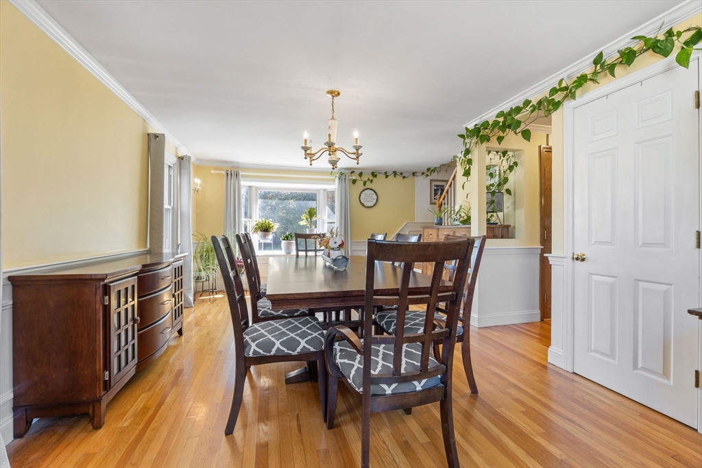 229 Washington Terrace Whitman, MA 02382 - Photo 13 of 30 a view of a dining room with furniture and chandelier
