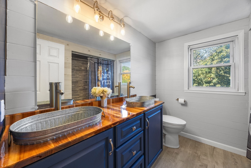229 Washington Terrace Whitman, MA 02382 - Photo 14 of 30 a room with two sinks a lamp and a window