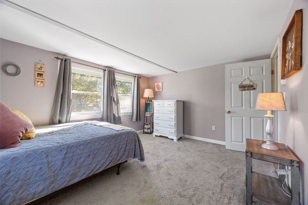 229 Washington Terrace Whitman, MA 02382 - Photo 19 of 30 a bedroom with a bed and a window