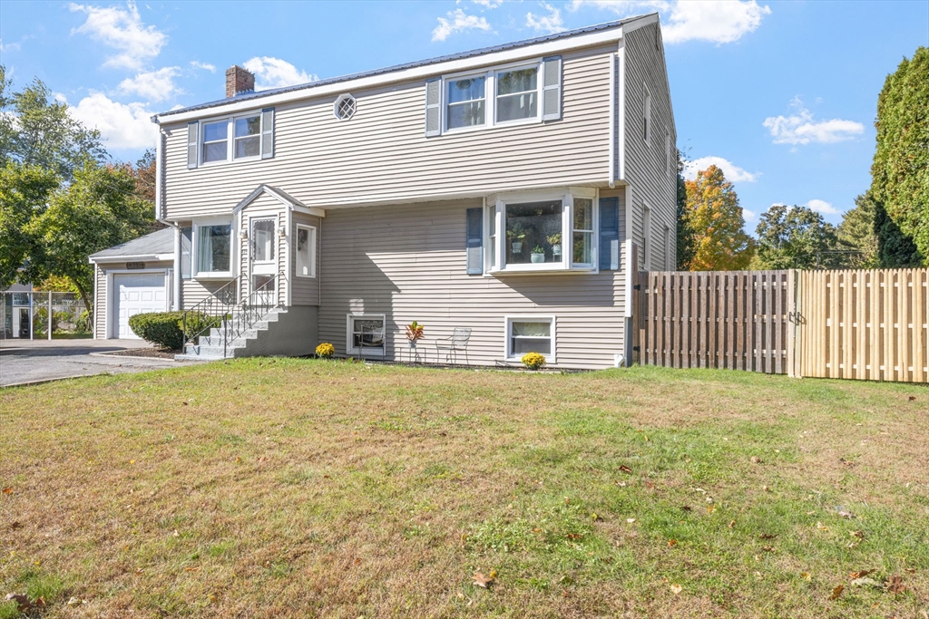 229 Washington Terrace Whitman, MA 02382 - Photo 2 of 30 a front view of a house with a yard
