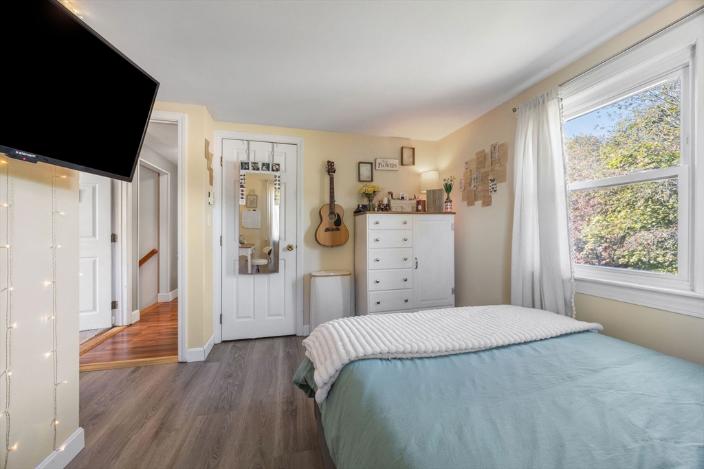 229 Washington Terrace Whitman, MA 02382 - Photo 21 of 30 a bedroom with a bed and a dresser next to a window