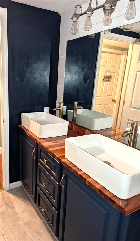 229 Washington Terrace Whitman, MA 02382 - Photo 23 of 30 a bathroom with a sink and a mirror