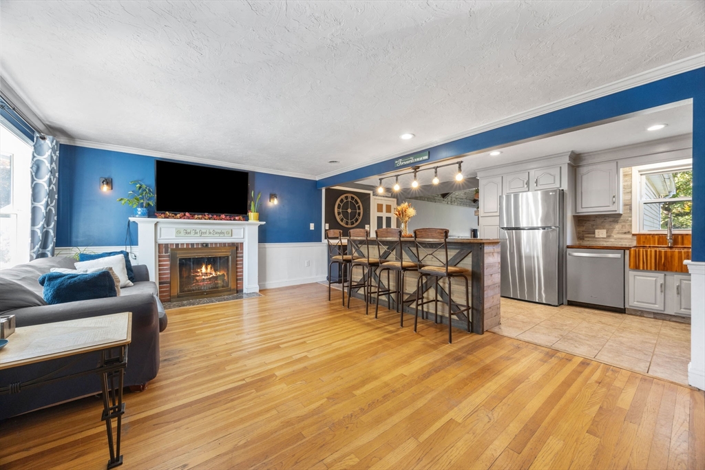 229 Washington Terrace Whitman, MA 02382 - Photo 10 of 30 a living room with furniture and a fireplace