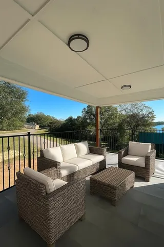 a view of couch and chairs