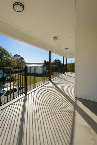 a view of a balcony with staircase