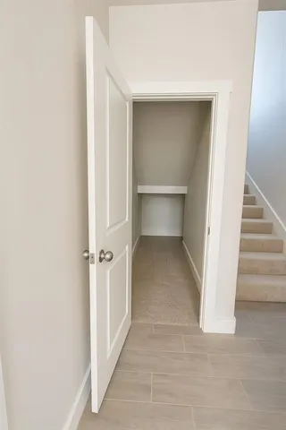 a view of a hallway with an empty room