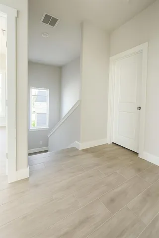 a view of an empty room with a window