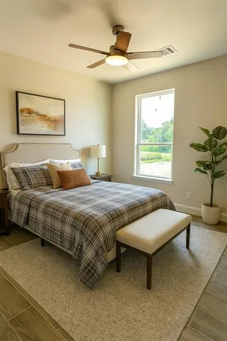 a bedroom with a bed and window