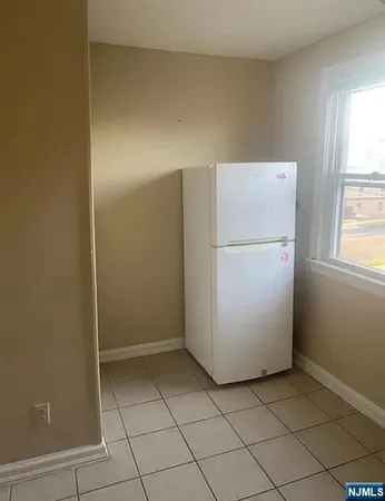 a utility room with cabinets washer and dryer