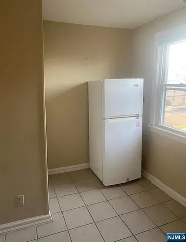 a utility room with cabinets washer and dryer