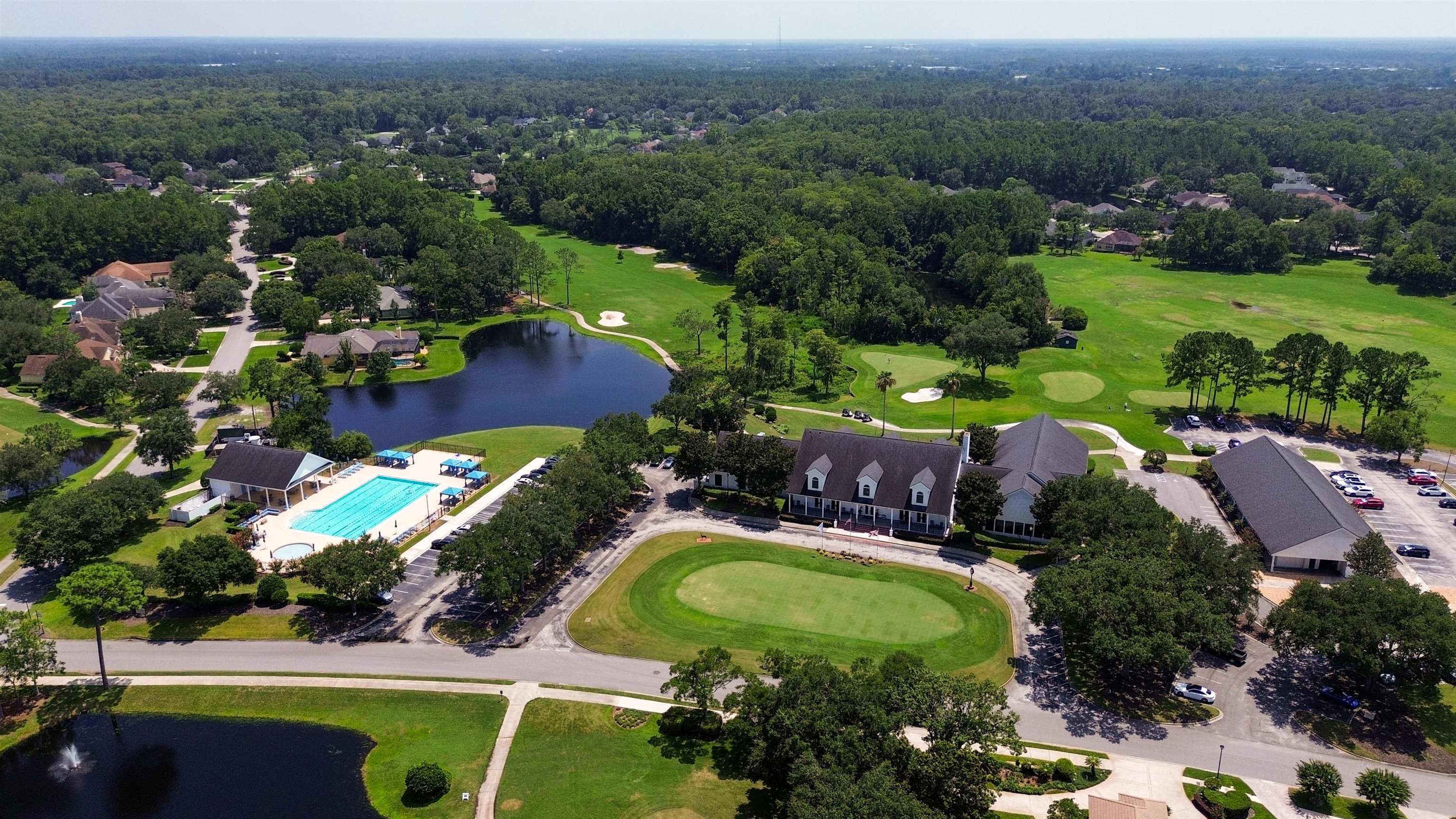 7849 Rittenhouse Lane Jacksonville, FL 32256 - Photo 12 of 50 an aerial view of a house with a garden and lake view