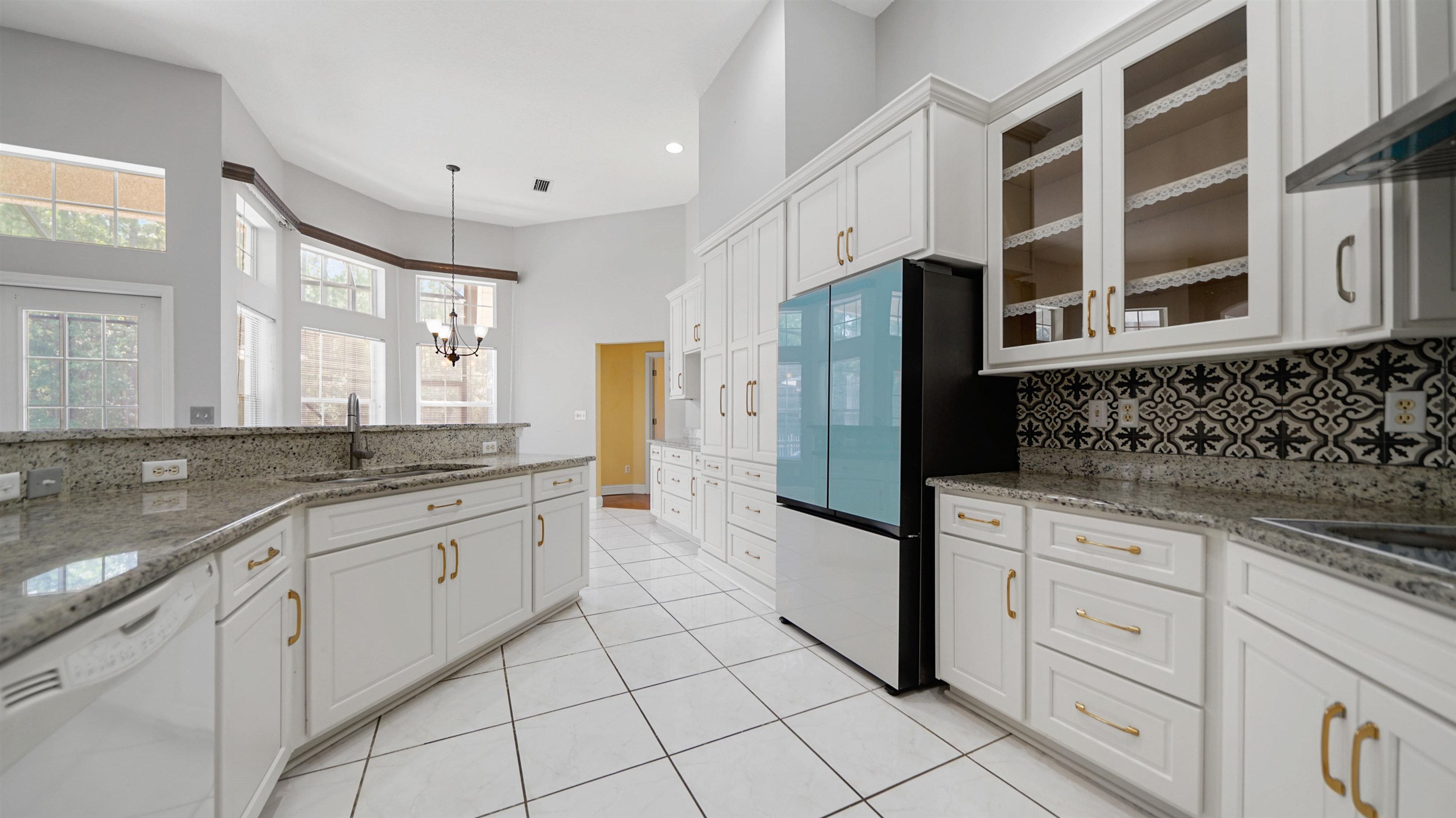7849 Rittenhouse Lane Jacksonville, FL 32256 - Photo 18 of 50 a large kitchen with granite countertop a sink and a stove top oven