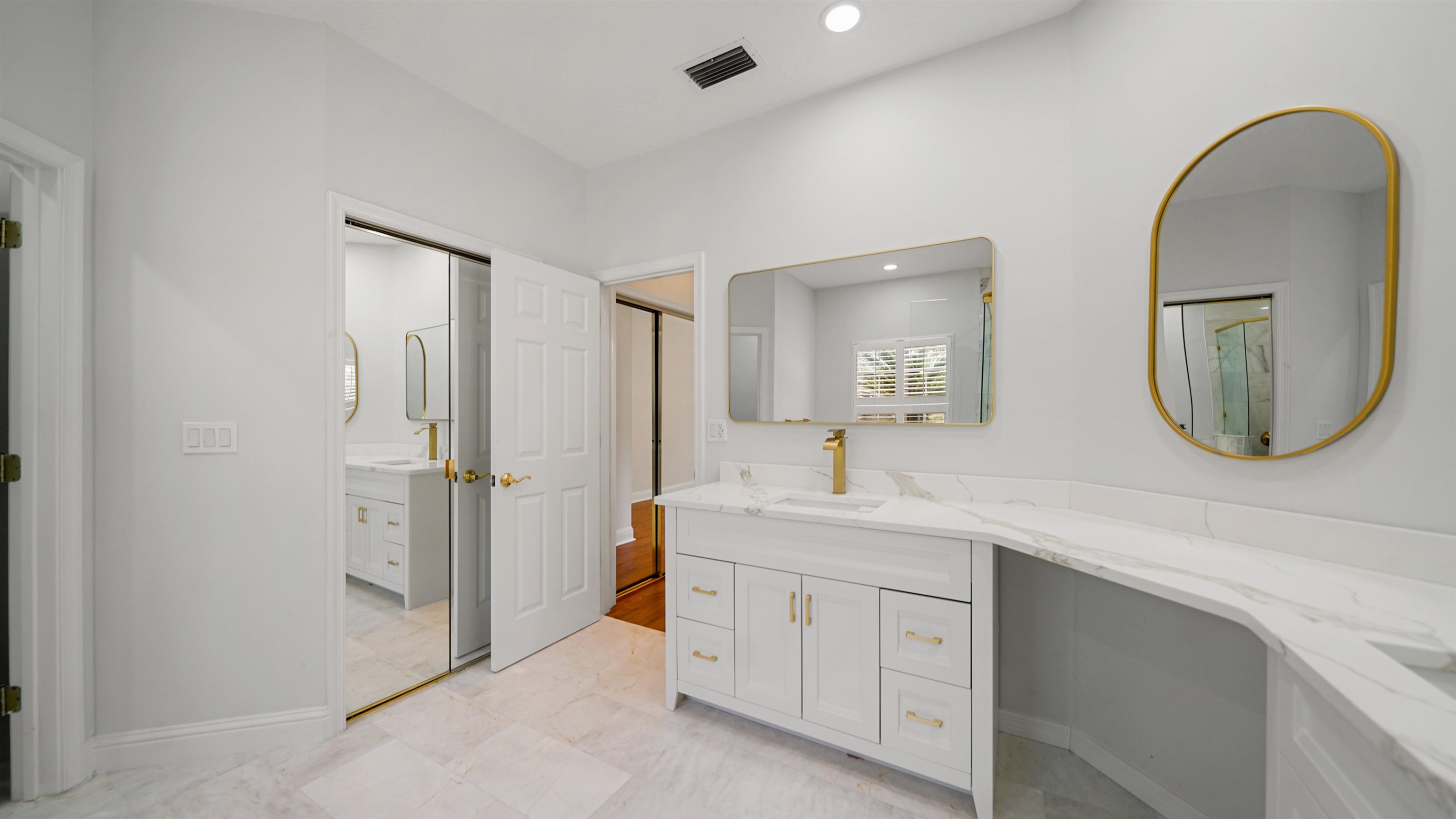 7849 Rittenhouse Lane Jacksonville, FL 32256 - Photo 21 of 50 a spacious bathroom with a double vanity sink and a mirror