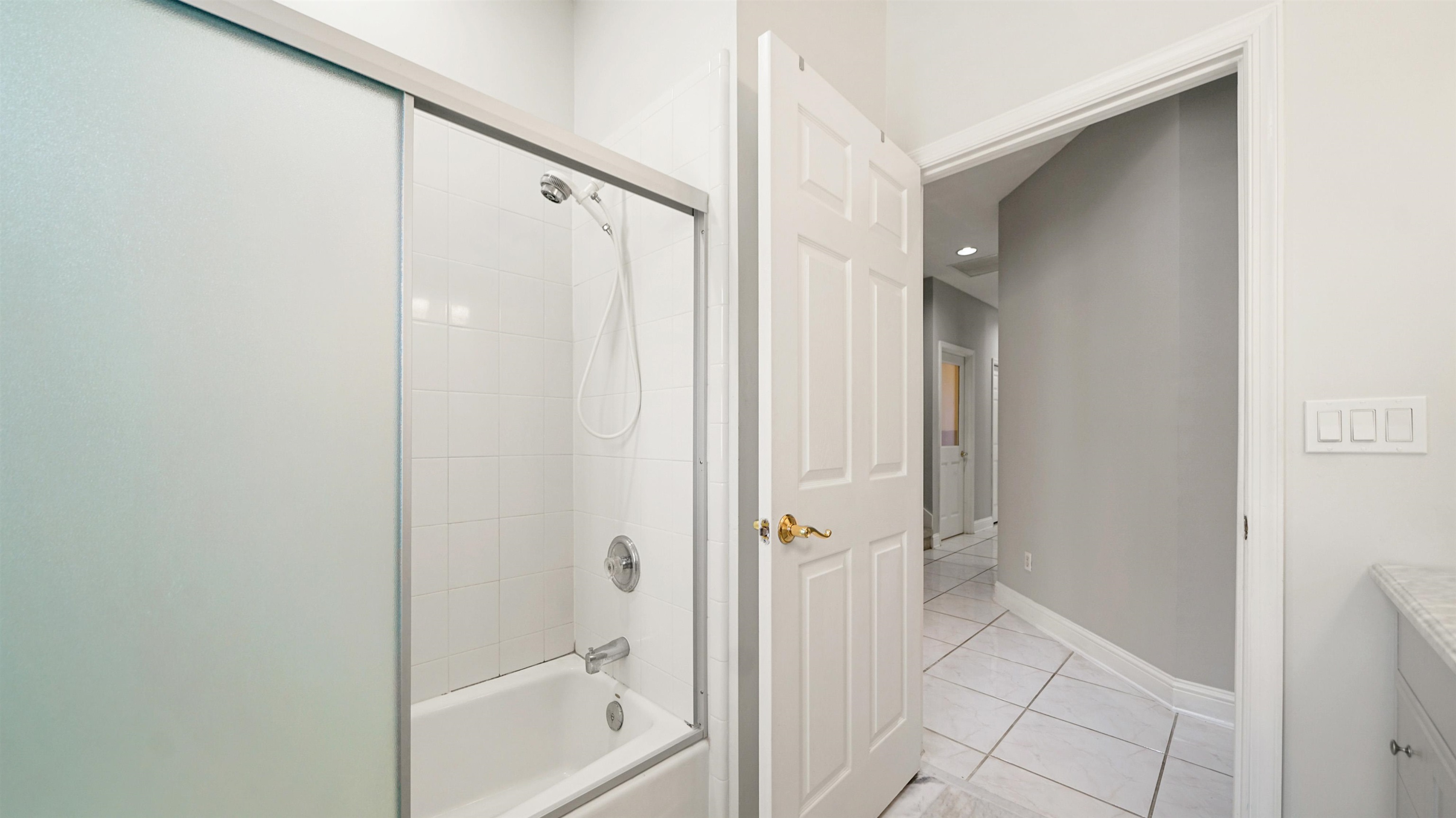 7849 Rittenhouse Lane Jacksonville, FL 32256 - Photo 27 of 50 a bathroom with a shower and a glass door