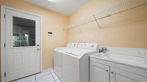 a utility room with dryer and washer