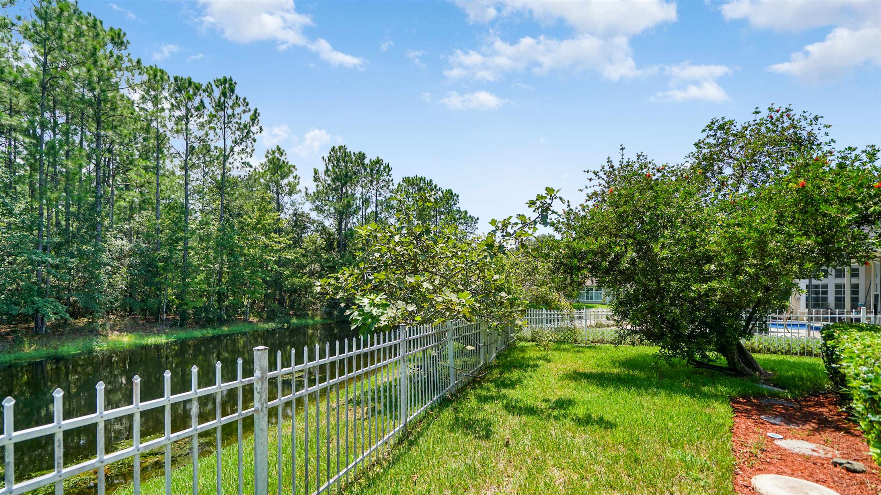 7849 Rittenhouse Lane Jacksonville, FL 32256 - Photo 35 of 50 a balcony with trees in the background