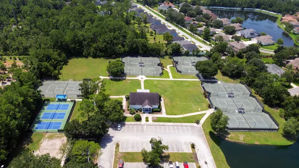 an aerial view of a house with outdoor space