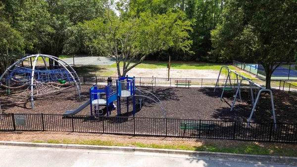 a view of swimming pool with sitting area