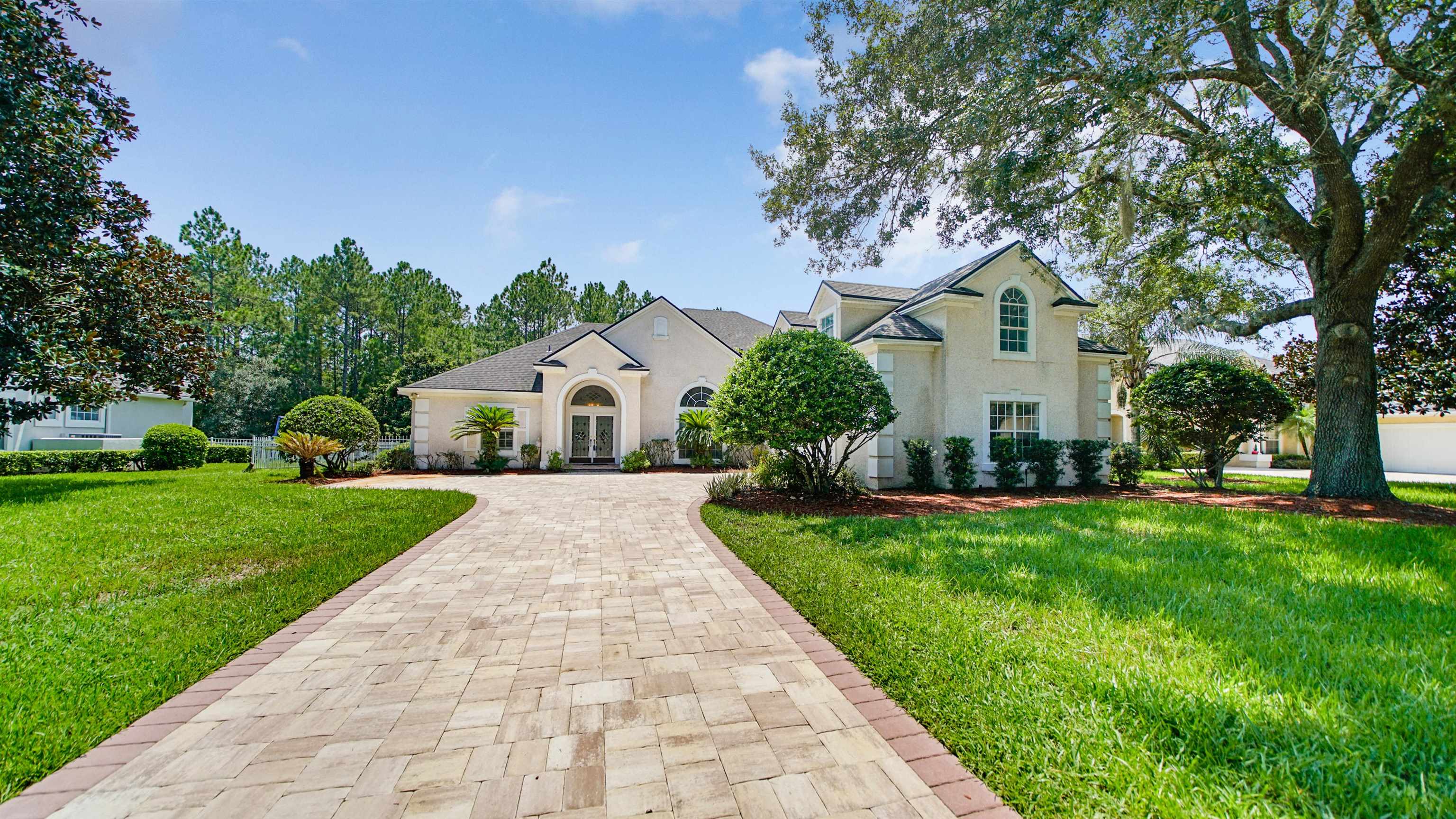 7849 Rittenhouse Lane Jacksonville, FL 32256 - Photo 50 of 50 a front view of a house with garden