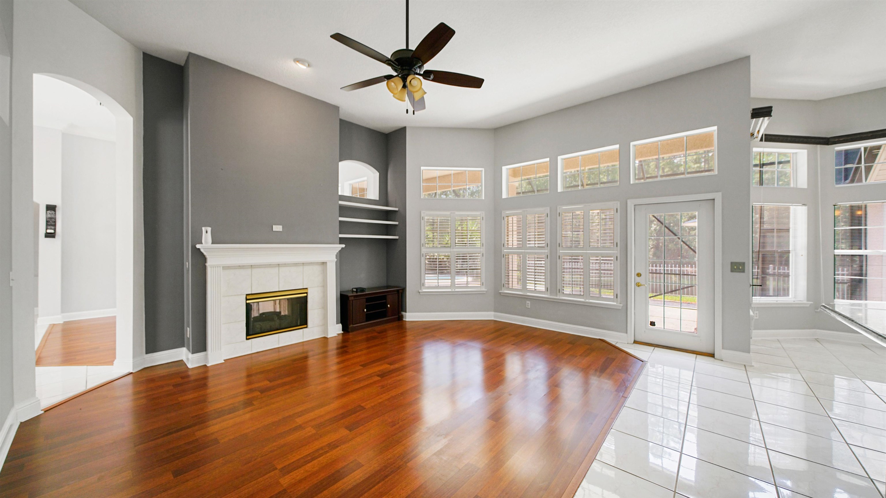 7849 Rittenhouse Lane Jacksonville, FL 32256 - Photo 5 of 50 a view of an empty room with a fireplace and a window
