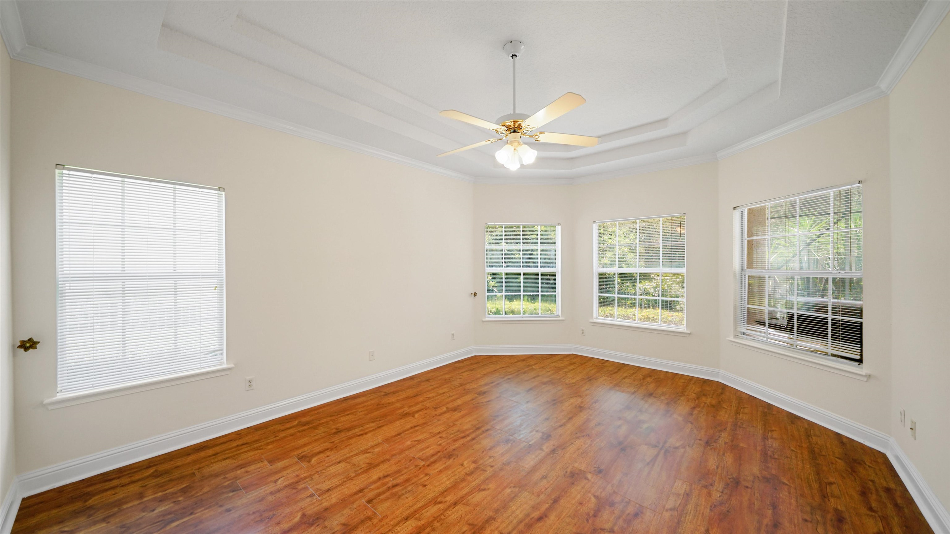 7849 Rittenhouse Lane Jacksonville, FL 32256 - Photo 8 of 50 a view of an empty room with a window and wooden floor