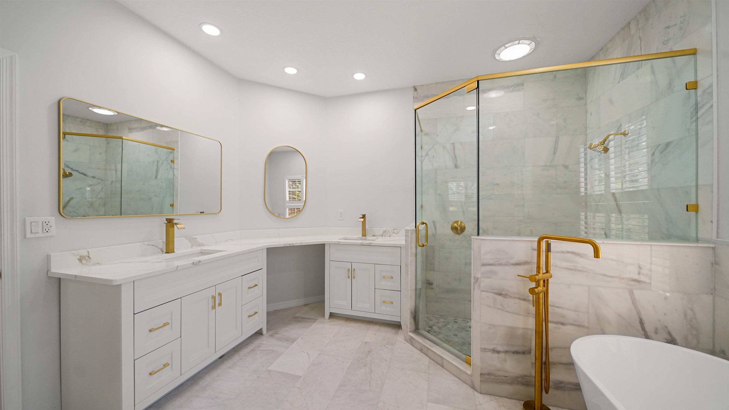 7849 Rittenhouse Lane Jacksonville, FL 32256 - Photo 9 of 50 a spacious bathroom with a double vanity sink toilet mirror and shower