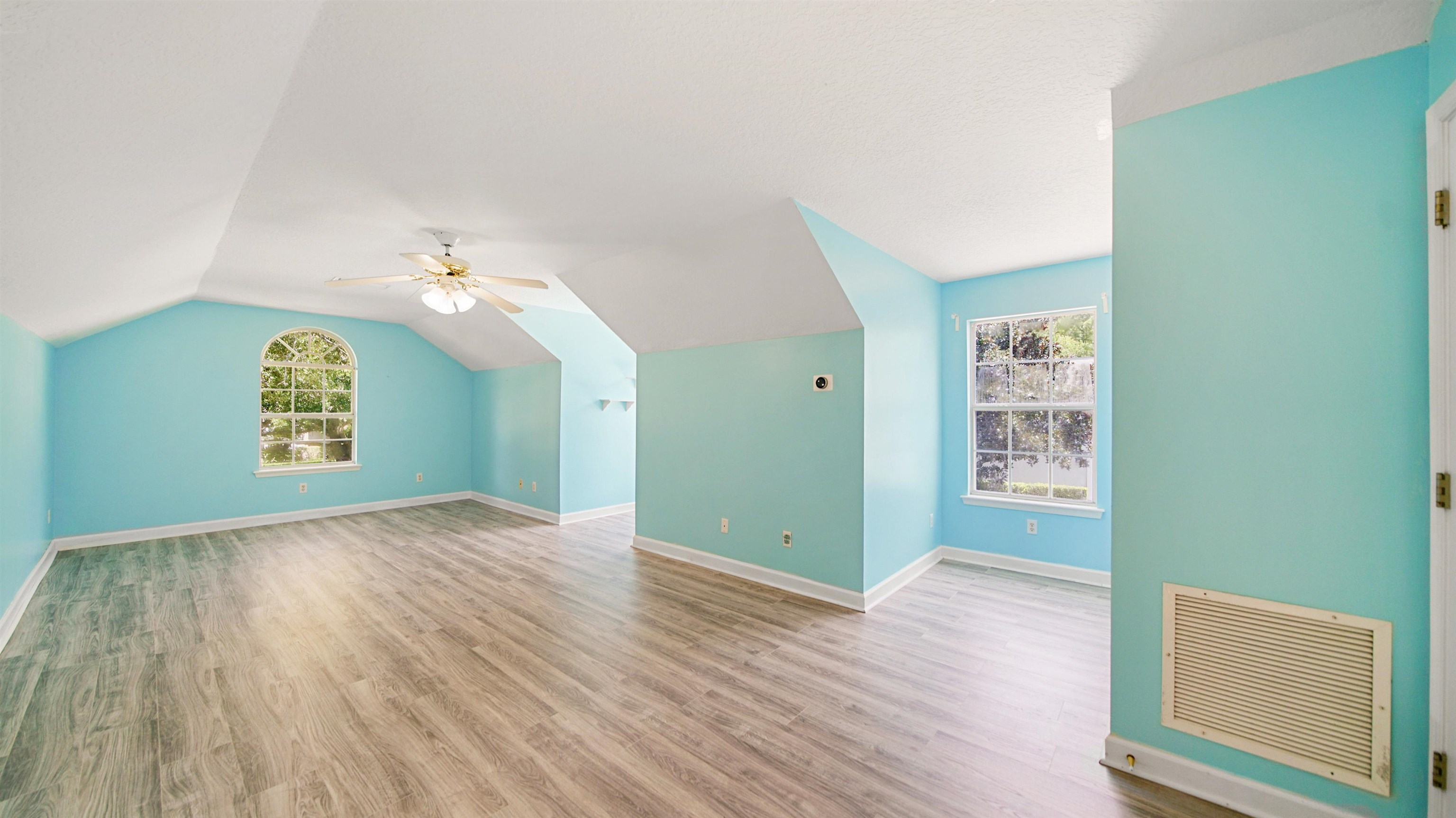 7849 Rittenhouse Lane Jacksonville, FL 32256 - Photo 10 of 50 an empty room with wooden floor and windows