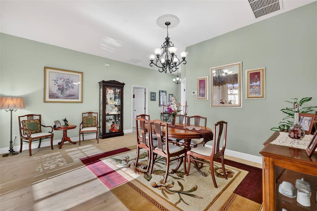 25517 Laurel Valley Road Leesburg, FL 34748 - Photo 11 of 56 a view of a dining room with furniture