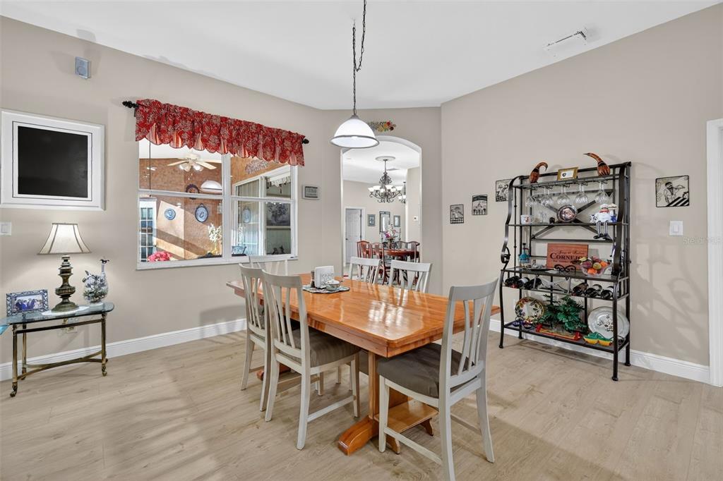 25517 Laurel Valley Road Leesburg, FL 34748 - Photo 19 of 56 a dining room with furniture and window