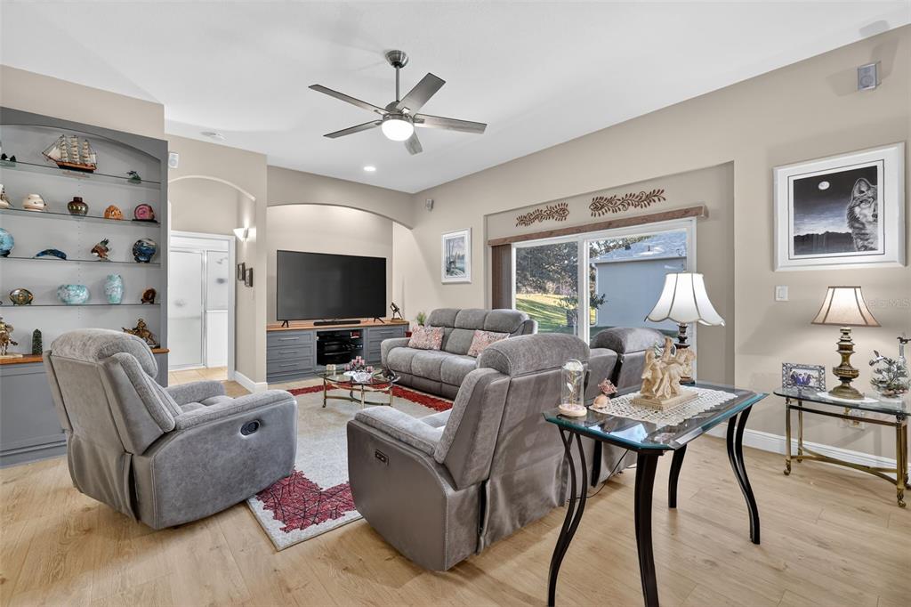 25517 Laurel Valley Road Leesburg, FL 34748 - Photo 21 of 56 a living room with furniture and a flat screen tv