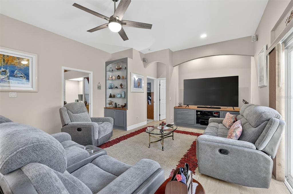 25517 Laurel Valley Road Leesburg, FL 34748 - Photo 24 of 56 a living room with furniture and a flat screen tv