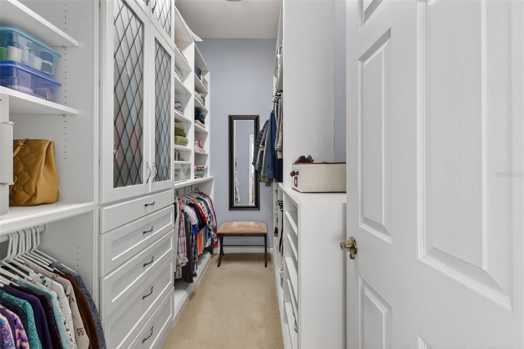 25517 Laurel Valley Road Leesburg, FL 34748 - Photo 29 of 56 a view of walk in closet with clothes and shoes